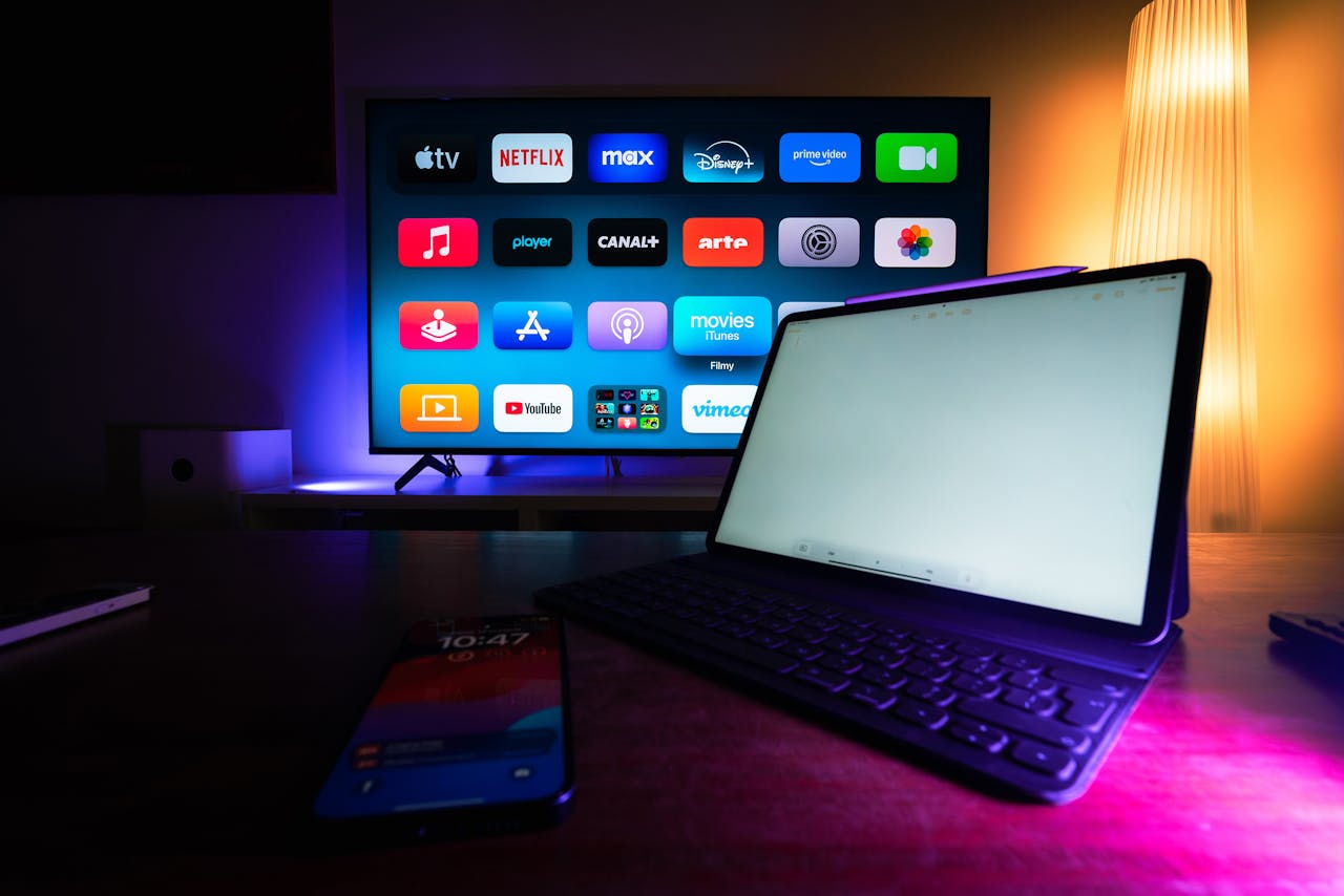 A modern home setup with a smart TV and tablet displaying various streaming apps, highlighting the digital lifestyle.